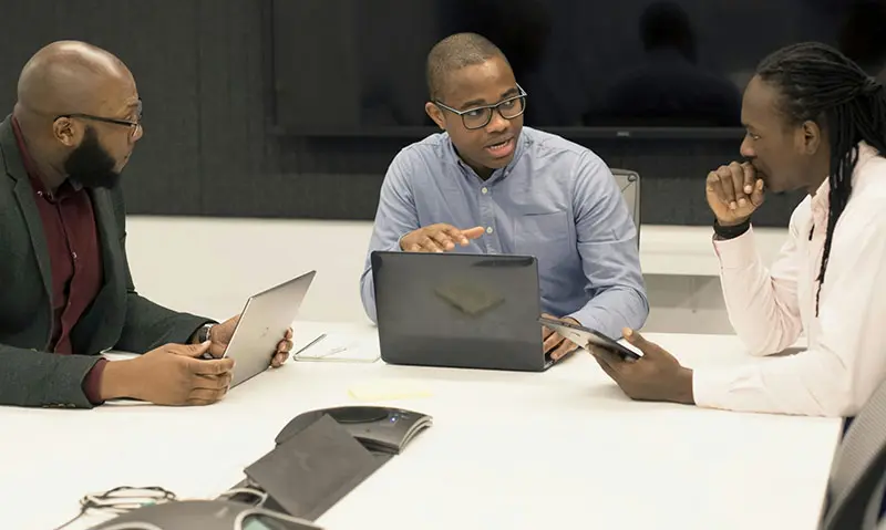 Business meeting discussing financial growth and strategy