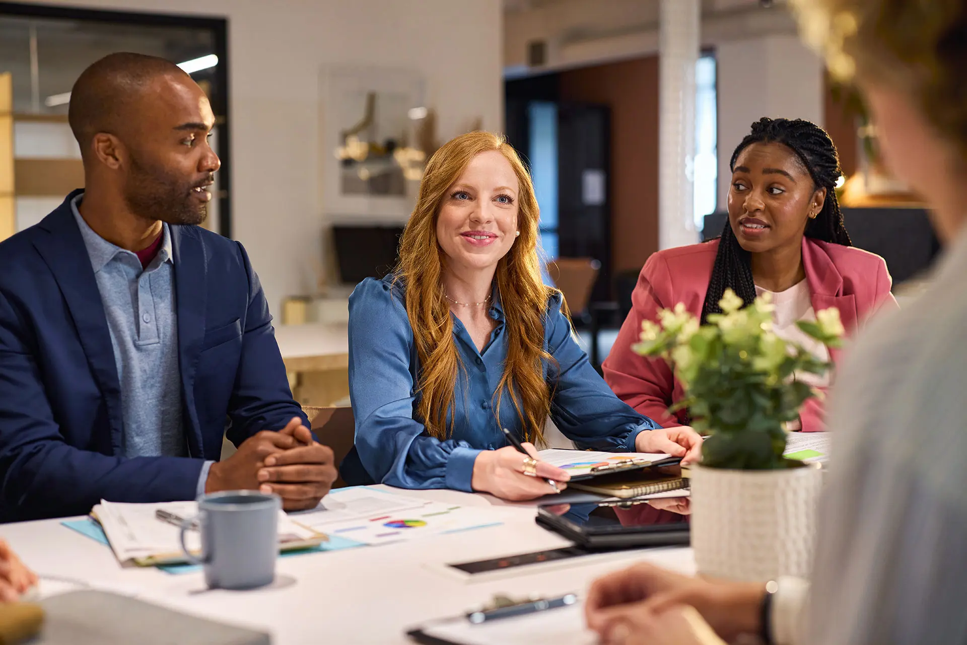 Business professionals discussing financial reports and business growth strategies